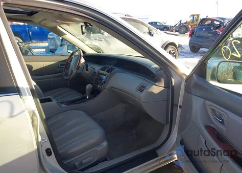 2003 Toyota Avalon Xls z USA, uszkodzony, nr VIN 4T1BF28B43U283522